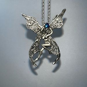 1996 fellowship foundry double winged fairy holding a blue glass ball